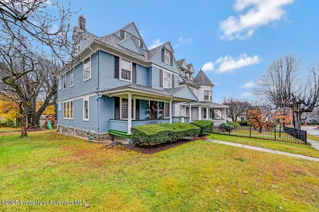 a front view of a building with a yard