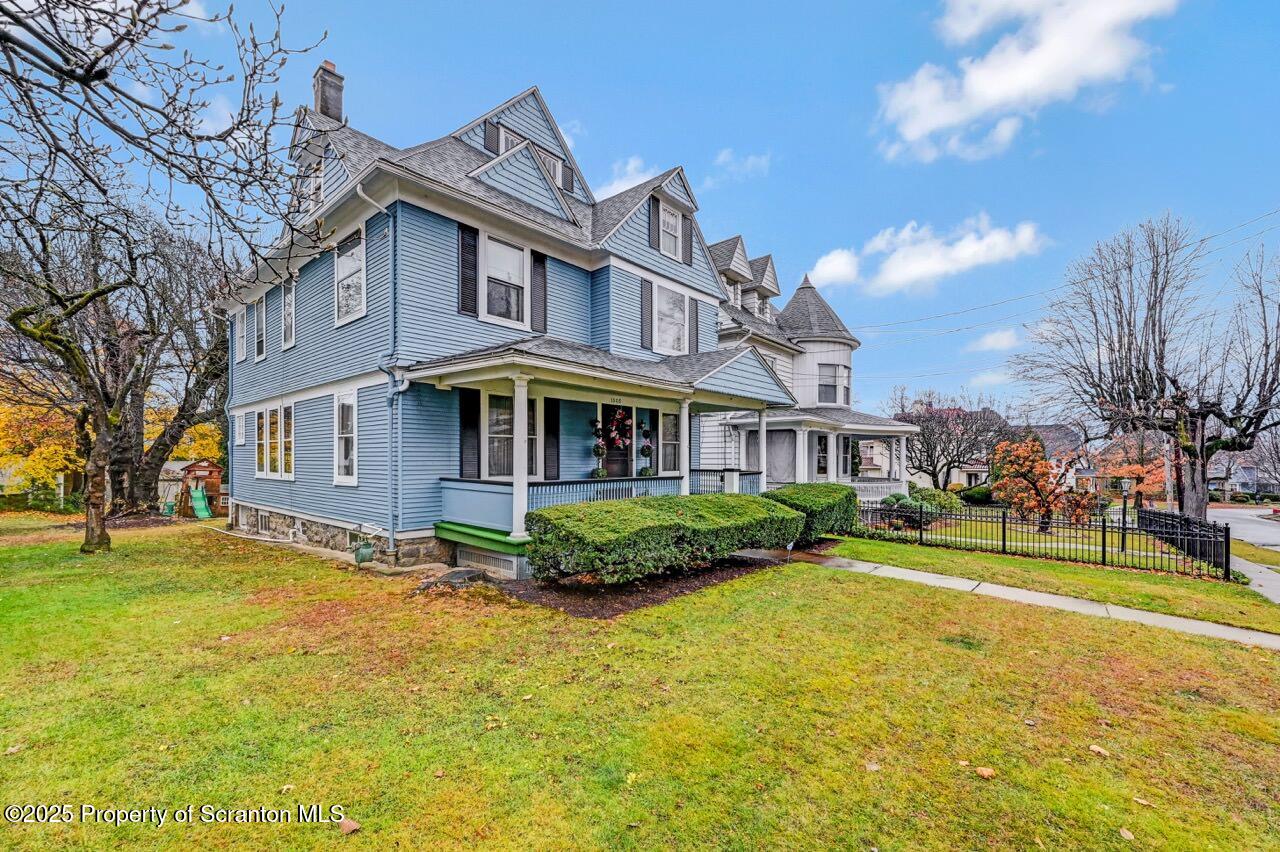 1008 Sunset Street Scranton, PA 18509 - Photo 5 of 54 a front view of a building with a yard