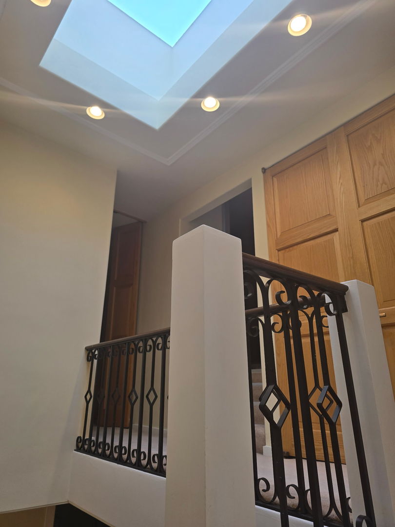 29 East Scott Street Chicago, IL 60610 - Photo 19 of 21 a view of staircase with white walls and a window