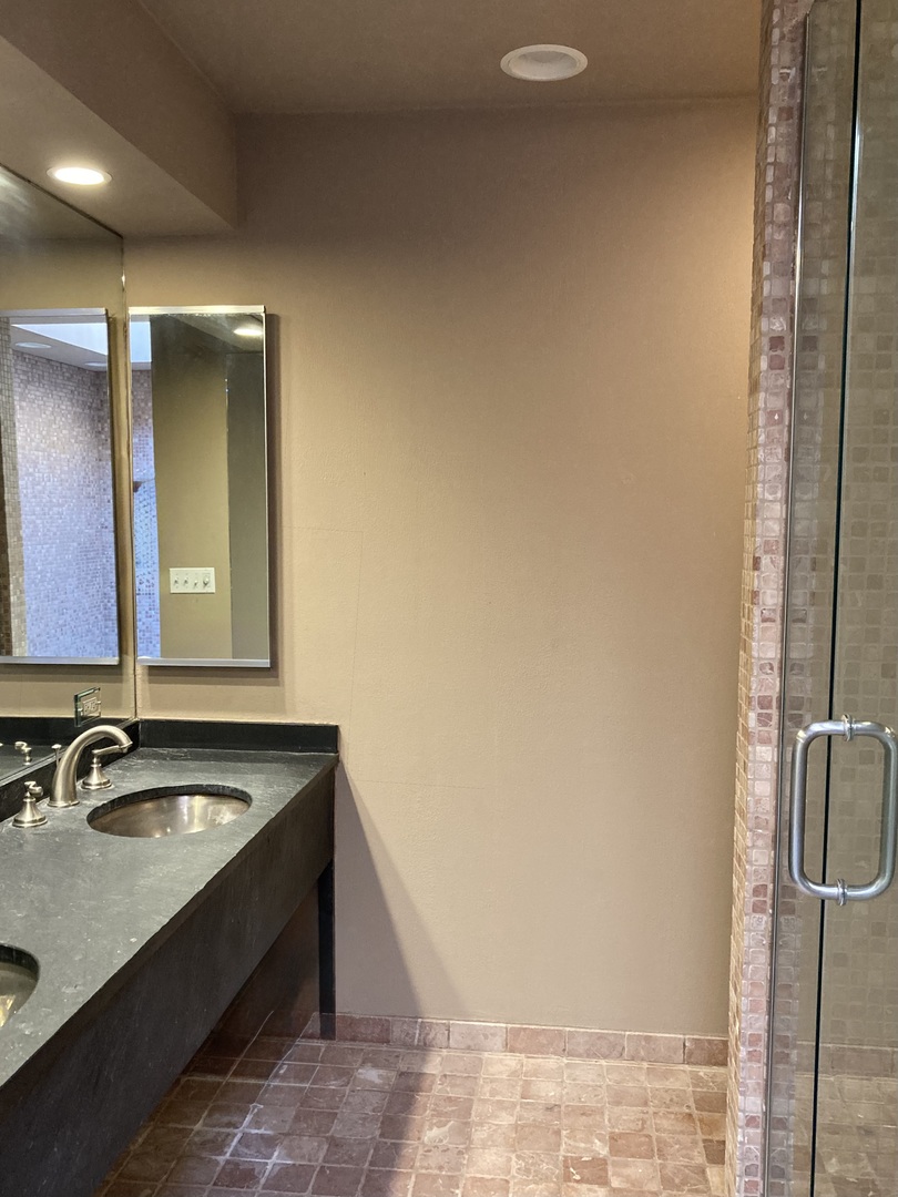 29 East Scott Street Chicago, IL 60610 - Photo 9 of 21 a bathroom with a sink and a mirror