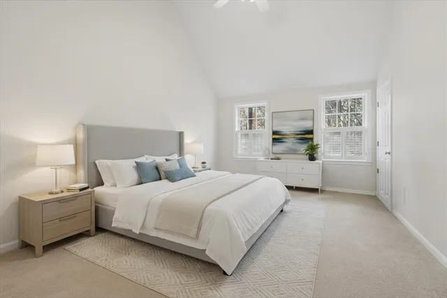 a bedroom with a bed and a lamp on table