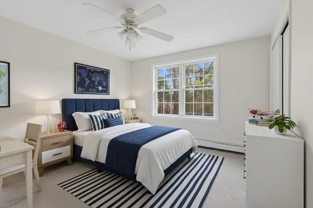 a bedroom with bed and a window