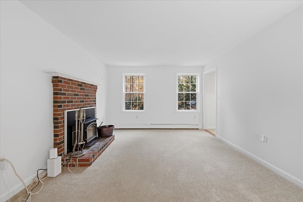 66 Box Pond Drive Bellingham, MA 02019 - Photo 14 of 41 an empty room with windows