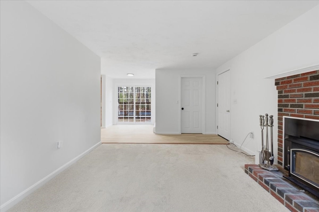 66 Box Pond Drive Bellingham, MA 02019 - Photo 15 of 41 a view of an empty room with a window