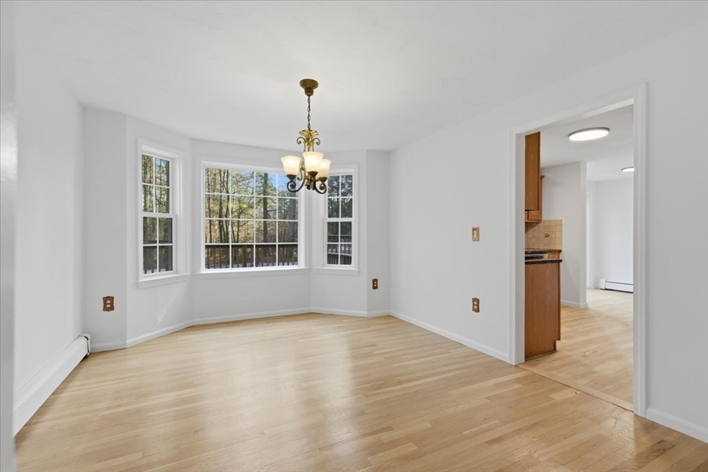 66 Box Pond Drive Bellingham, MA 02019 - Photo 20 of 41 a view of an empty room with a window