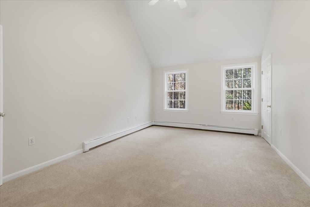 66 Box Pond Drive Bellingham, MA 02019 - Photo 21 of 41 an empty room with windows