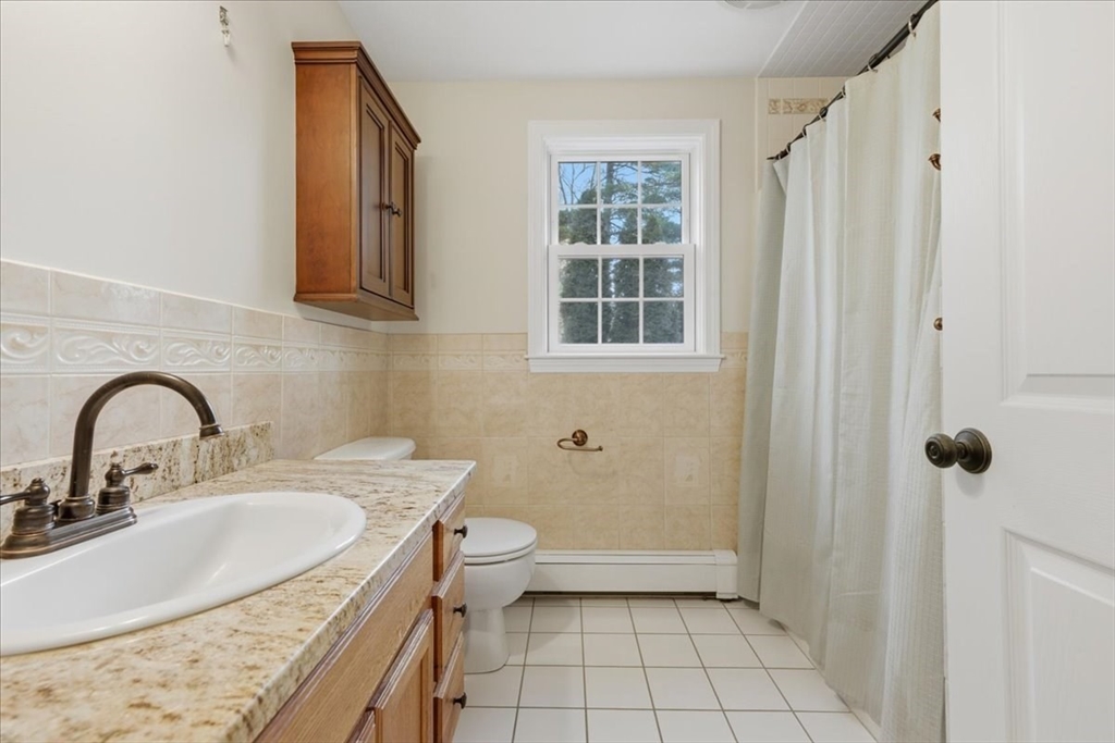 66 Box Pond Drive Bellingham, MA 02019 - Photo 22 of 41 a bathroom with a sink toilet and shower