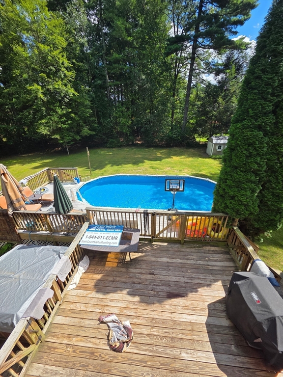 66 Box Pond Drive Bellingham, MA 02019 - Photo 31 of 41 a view of a swimming pool with a lounge chair