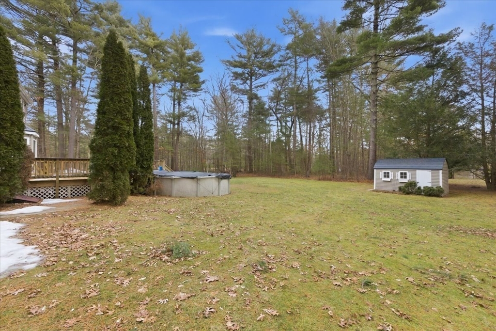 66 Box Pond Drive Bellingham, MA 02019 - Photo 33 of 41 a backyard of a house with lots of green space