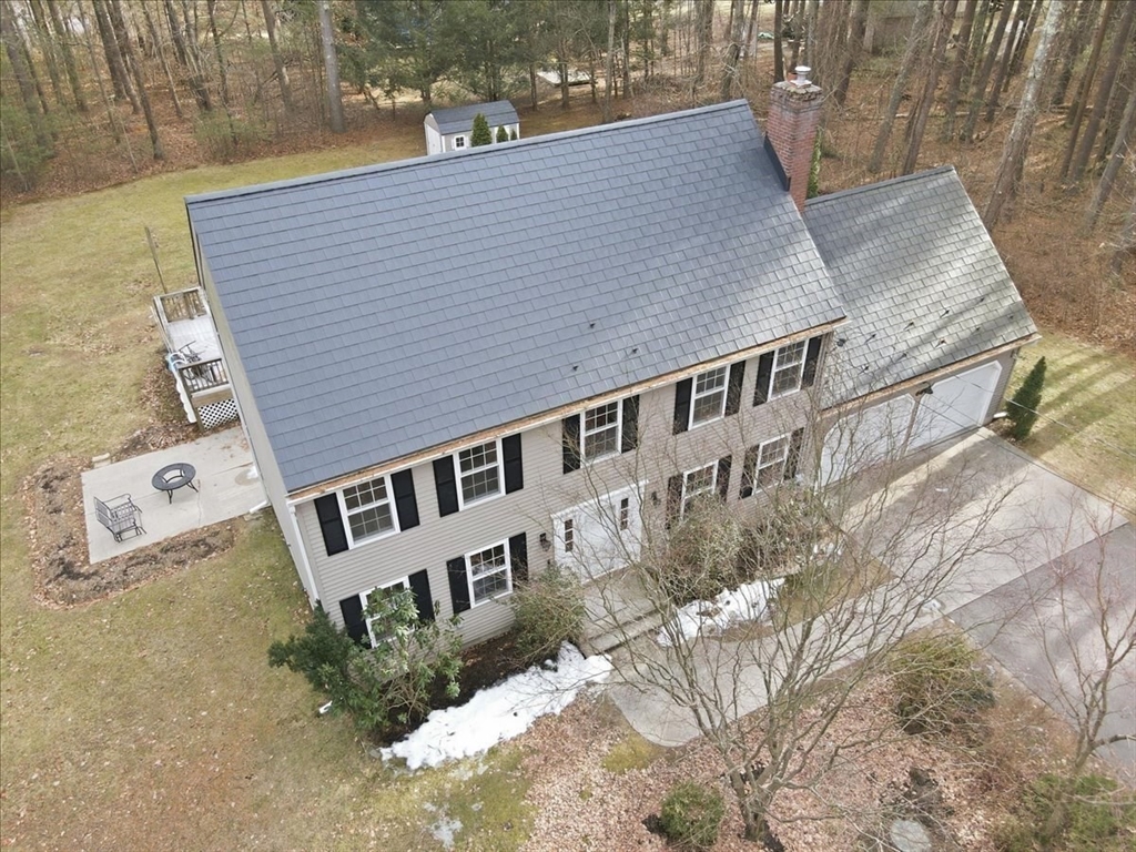 66 Box Pond Drive Bellingham, MA 02019 - Photo 37 of 41 a backyard of a house with a yard and outdoor seating