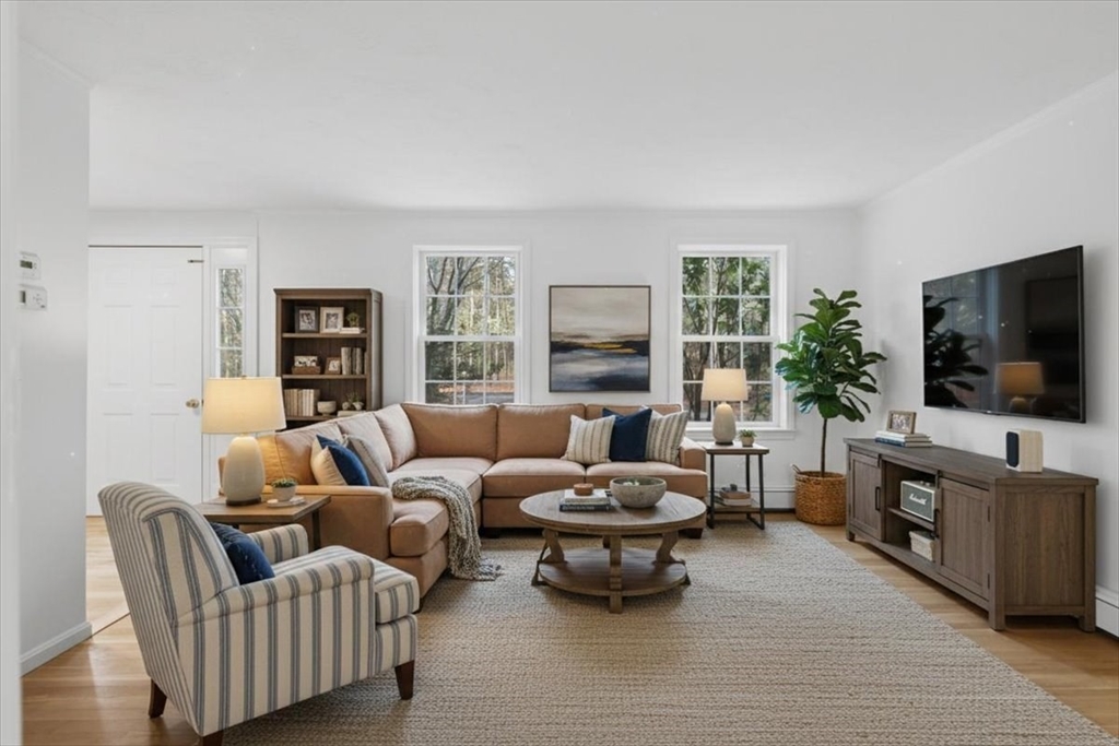 66 Box Pond Drive Bellingham, MA 02019 - Photo 4 of 41 a living room with furniture and a flat screen tv