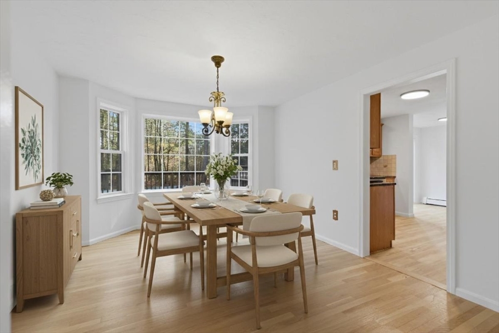 66 Box Pond Drive Bellingham, MA 02019 - Photo 5 of 41 a view of a dining room with furniture window and wooden floor