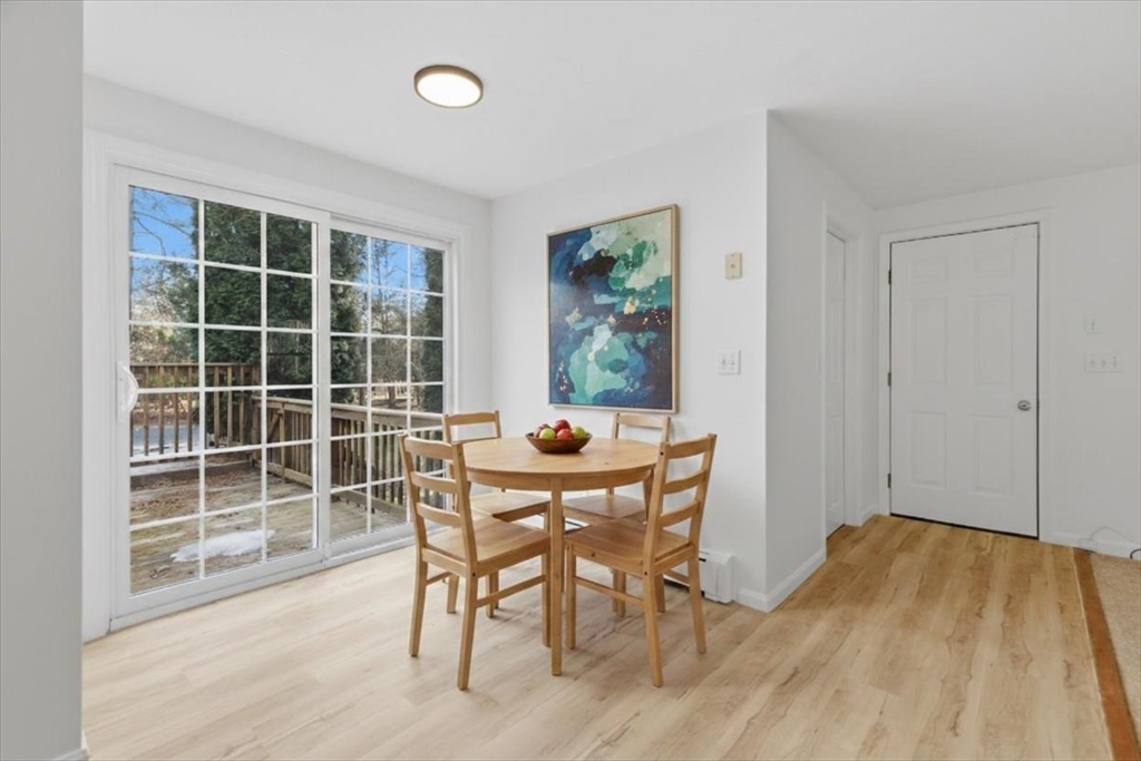 66 Box Pond Drive Bellingham, MA 02019 - Photo 7 of 41 a view of a dining room with furniture and wooden floor