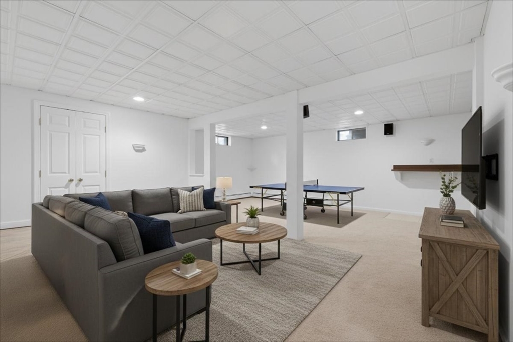 66 Box Pond Drive Bellingham, MA 02019 - Photo 10 of 41 a living room with furniture and a wooden floor