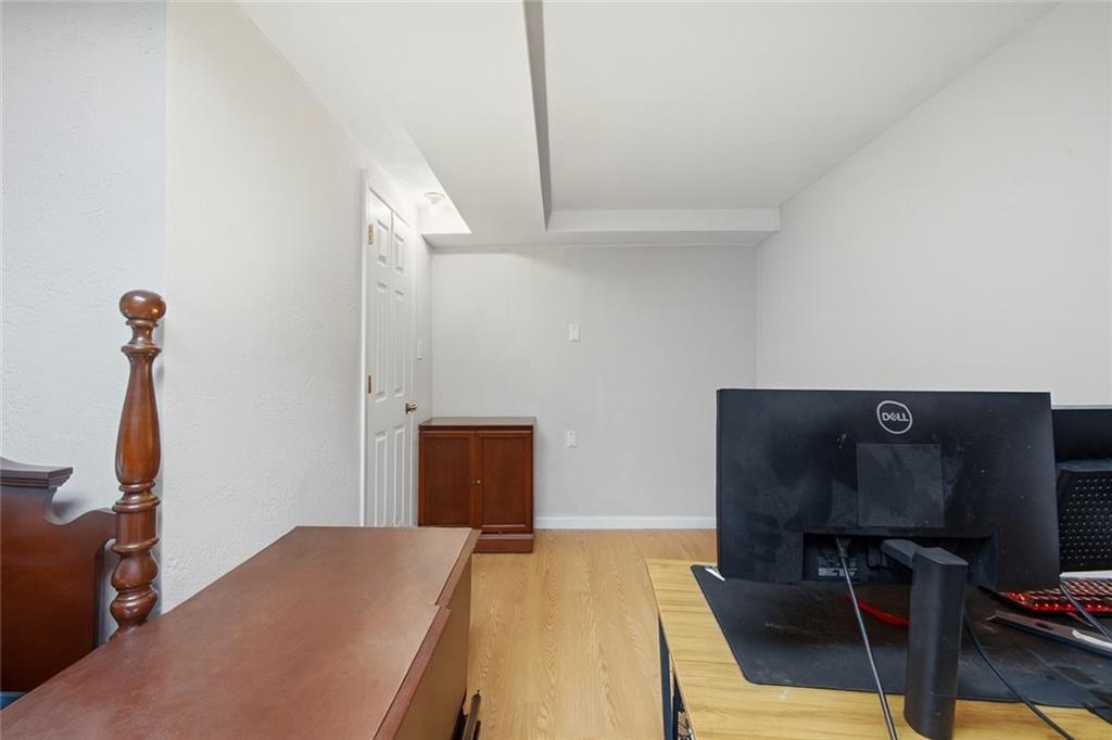 2725 Locust Drive Pittsburgh, PA 15241 - Photo 28 of 40 a bedroom with a bed and wooden floor