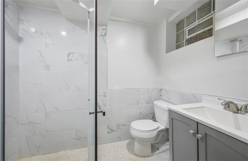 2725 Locust Drive Pittsburgh, PA 15241 - Photo 29 of 40 a bathroom with a toilet sink and shower