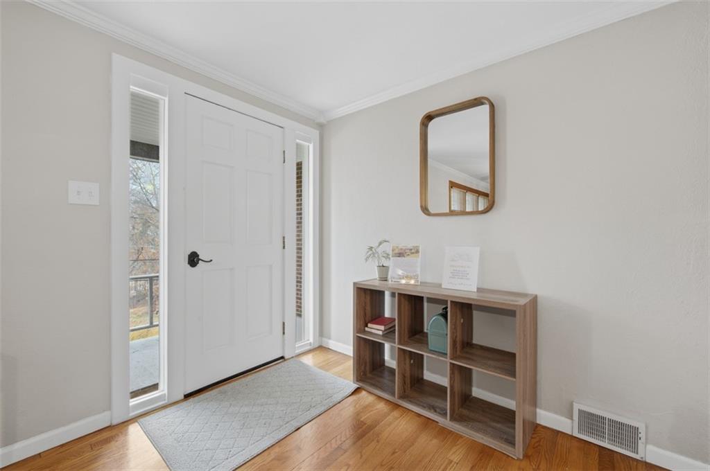 2725 Locust Drive Pittsburgh, PA 15241 - Photo 3 of 40 a view of a workspace with furniture and wooden floor