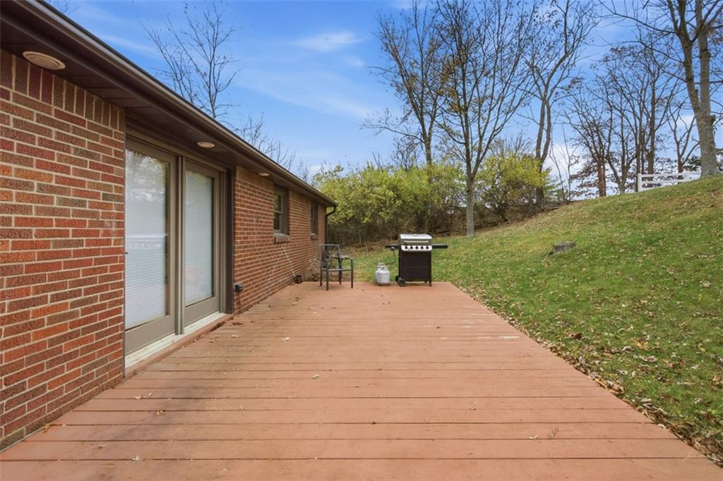 2725 Locust Drive Pittsburgh, PA 15241 - Photo 31 of 40 a backyard of a house with large trees and brick walls