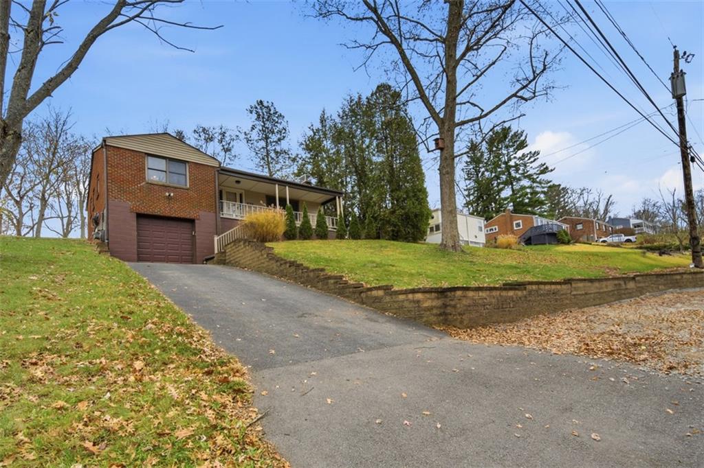 2725 Locust Drive Pittsburgh, PA 15241 - Photo 39 of 40 a front view of a house with a yard