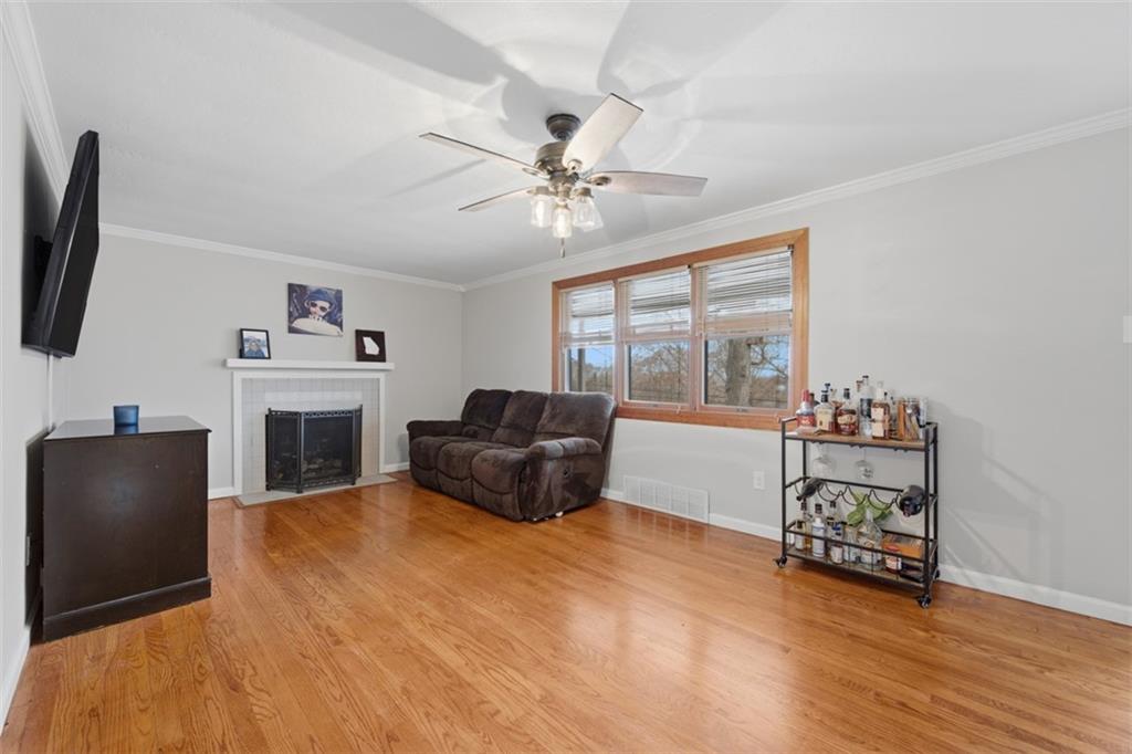 2725 Locust Drive Pittsburgh, PA 15241 - Photo 5 of 40 a living room with furniture and a flat screen tv