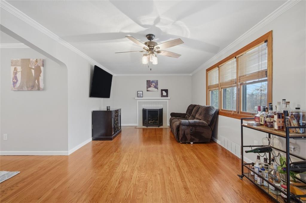2725 Locust Drive Pittsburgh, PA 15241 - Photo 6 of 40 a living room with furniture a fireplace and a flat screen tv