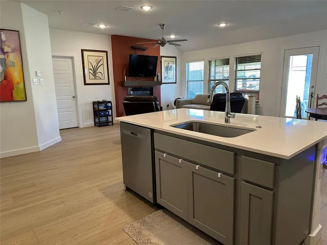 a dining table chair and a refrigerator in a kitchen