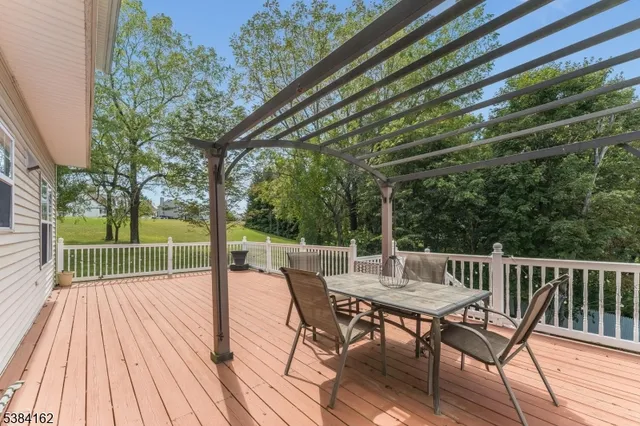 a view of a balcony with a floor to ceiling window and wooden floor