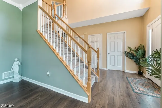a view of entryway with wooden floor