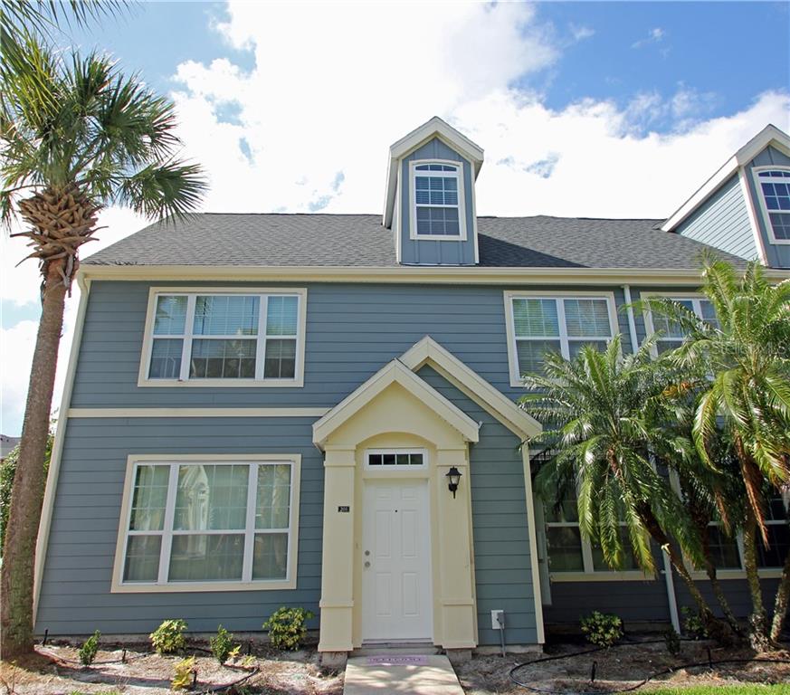 5560 Rosehill Road, Unit 203 Sarasota, FL 34233 - Photo 1 of 1 a front view of a house with a yard