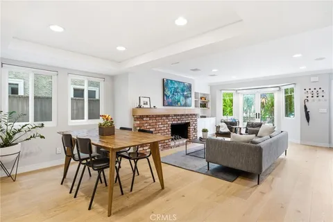 a living room with furniture a fireplace and a table