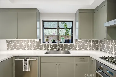 a kitchen with a sink and a window