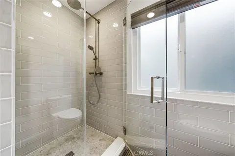 a view of walk in closet with clothes