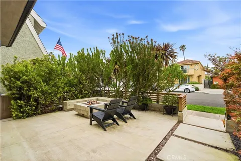 a view of a backyard with sitting area