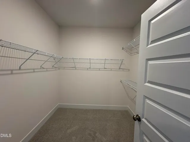 a view of a room with racks on the wall