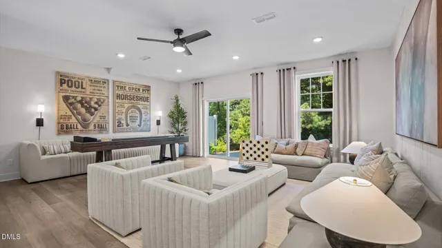 a living room with furniture and windows