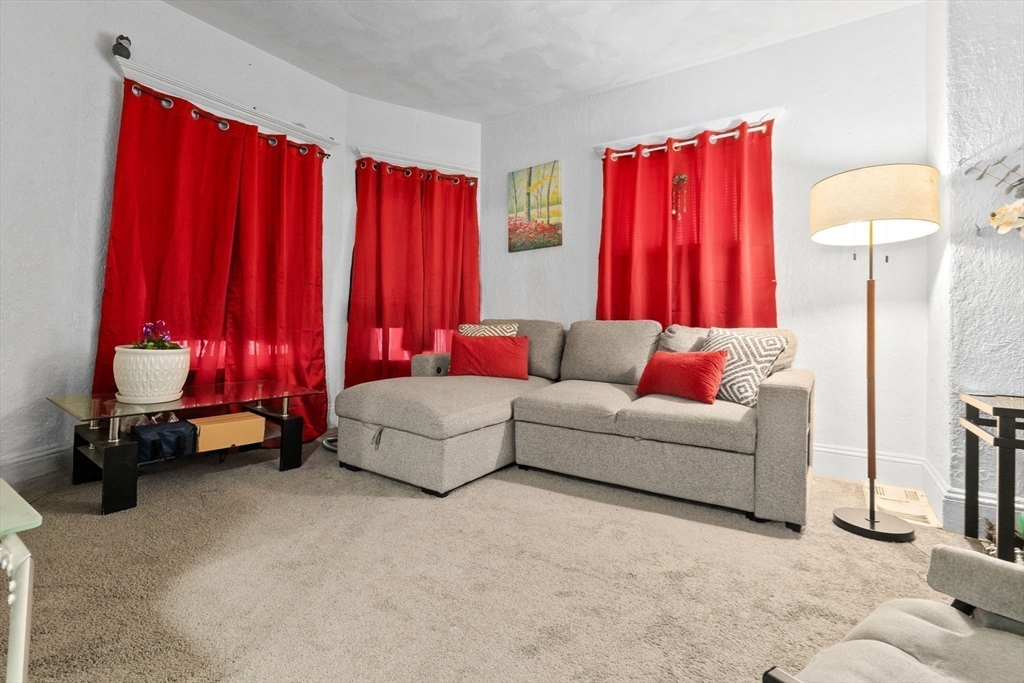 132 Vernal Street Everett, MA 02149 - Photo 12 of 22 a living room with furniture and a furniture