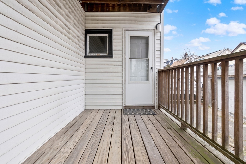 132 Vernal Street Everett, MA 02149 - Photo 18 of 22 a view of a balcony with wooden floor