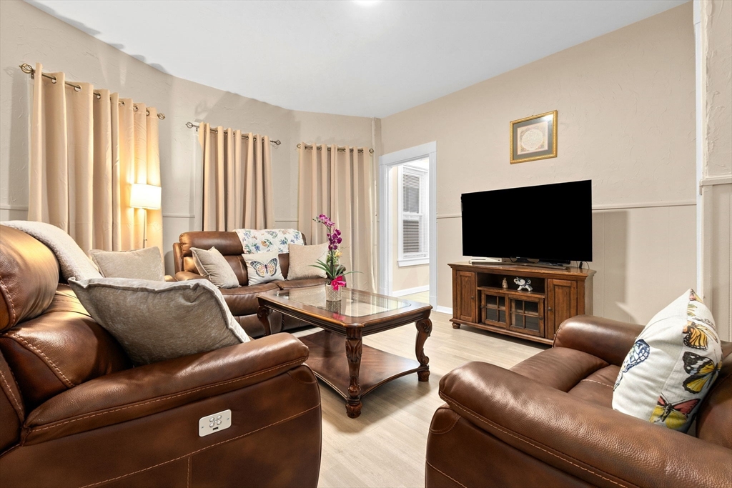 132 Vernal Street Everett, MA 02149 - Photo 2 of 22 a living room with furniture and a flat screen tv