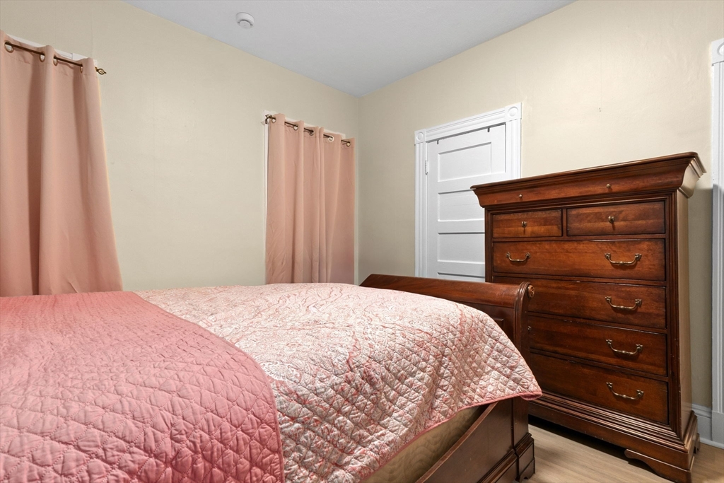 132 Vernal Street Everett, MA 02149 - Photo 3 of 22 a bedroom with a bed and a dresser