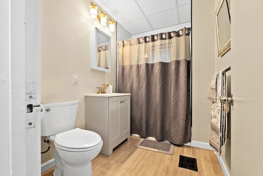 132 Vernal Street Everett, MA 02149 - Photo 4 of 22 a bathroom with a sink toilet and shower