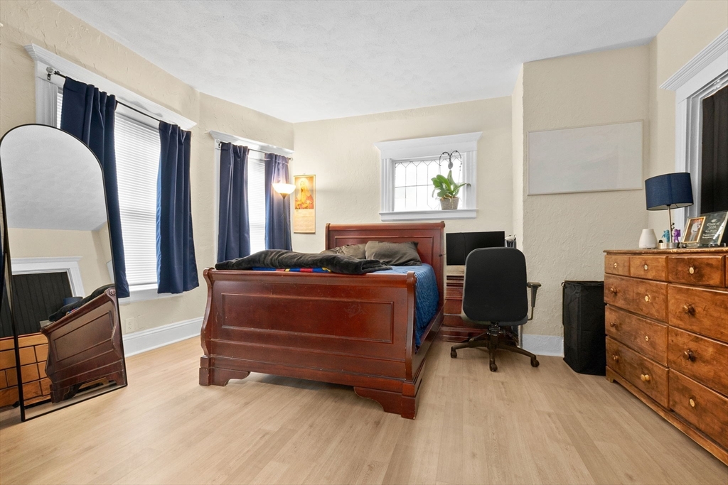 132 Vernal Street Everett, MA 02149 - Photo 5 of 22 a living room with furniture a flat screen tv and dresser