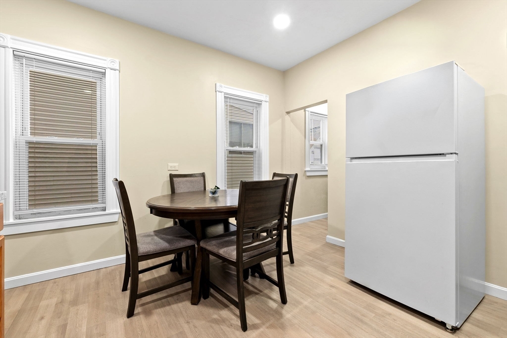 132 Vernal Street Everett, MA 02149 - Photo 7 of 22 a view of a dining room with furniture and a refrigerator