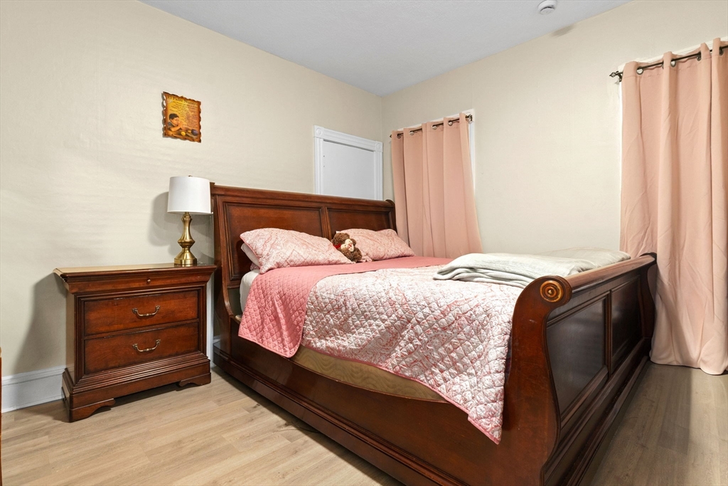 132 Vernal Street Everett, MA 02149 - Photo 8 of 22 a bedroom with a bed and a window