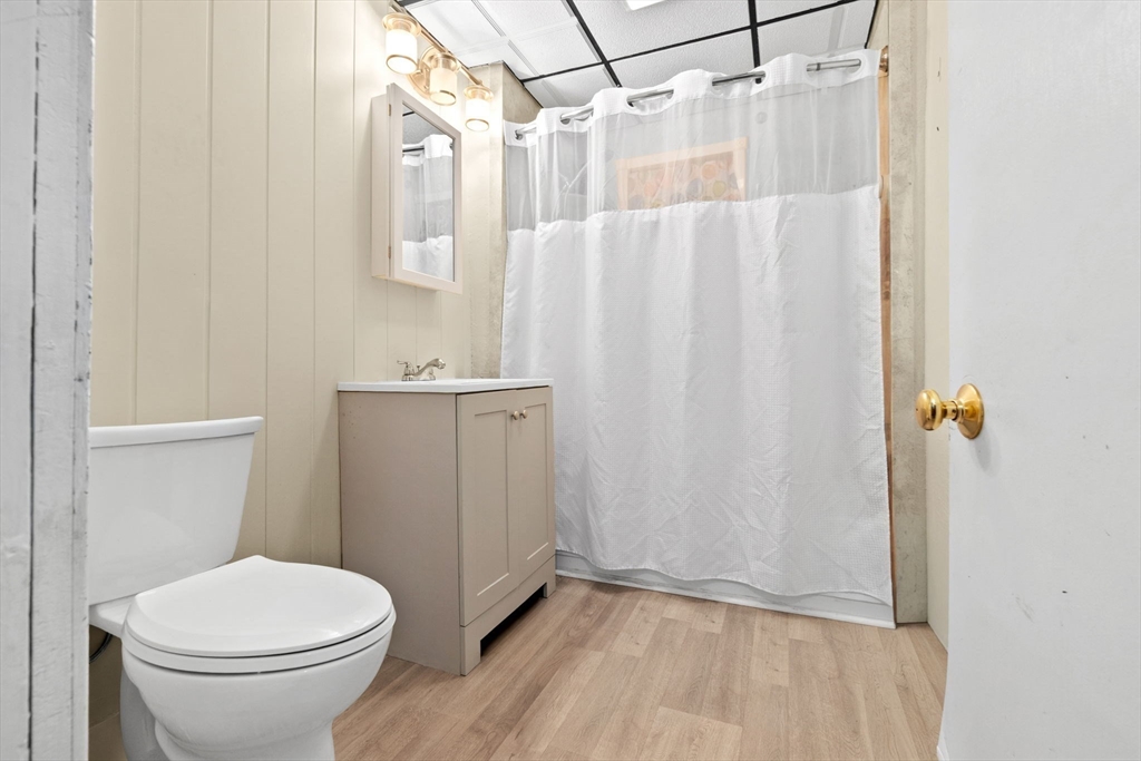 132 Vernal Street Everett, MA 02149 - Photo 9 of 22 a bathroom with a sink a toilet and shower
