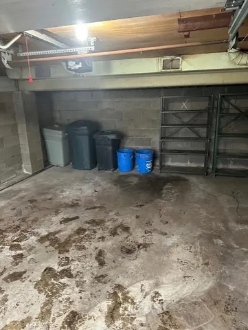 a view of a storage room with a sink and cabinets
