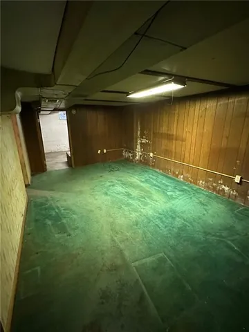 a view of a storage room with a sink and cabinets