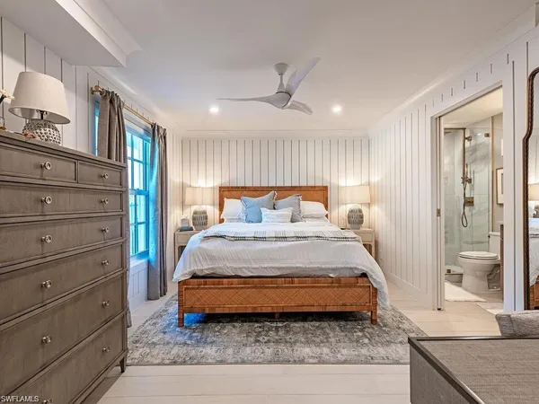 a bedroom with a bed and a dresser