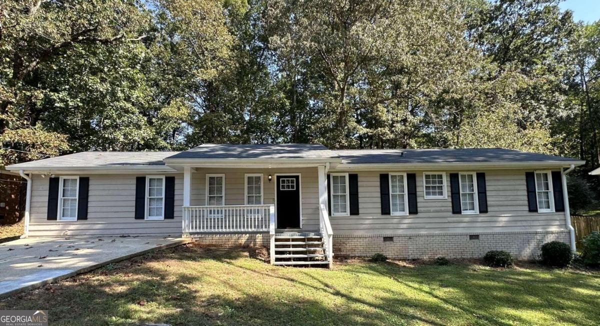 3869 Rosedale Lane Douglasville, GA 30135 - Photo 1 of 1 front view of a house with a yard