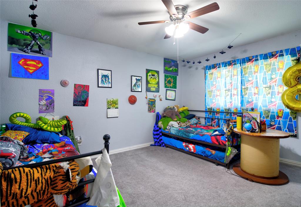 4825 Bobtown Road Garland, TX 75043 - Photo 13 of 17 a bedroom with toys and a tv