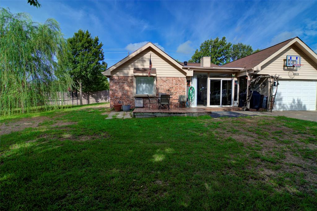 4825 Bobtown Road Garland, TX 75043 - Photo 17 of 17 a front view of a house with a yard and green space
